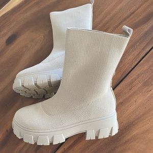 This season's current style fave: the trans-seasonal lug boot. Size runs small.